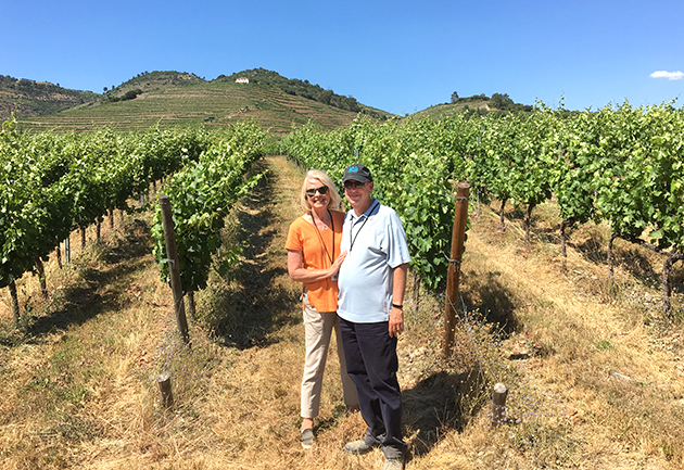 Sandy and Pat Hiatte have traveled extensively, shown here in Portugal — one of their favortie spots — where they posed during a visit to Qunta da Roeda Winery in the Douro Valley.   
