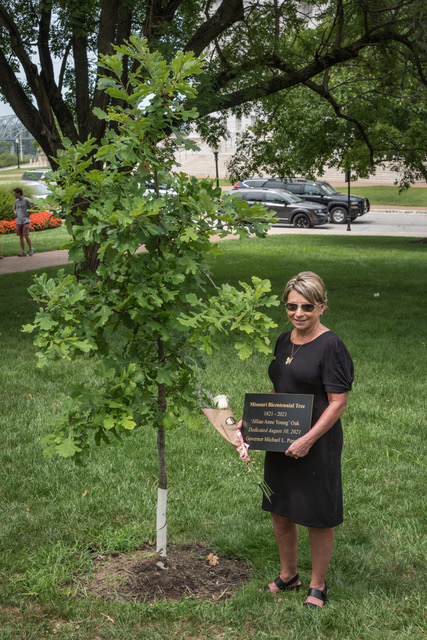 Kim Lovelace Hainsfurther of Forrest Keeling Nursery – who along with her Father Wayne Lovelace gifted the Legacy Oaks to MUBG – poses by the ‘Jillian Anne Young’ oak