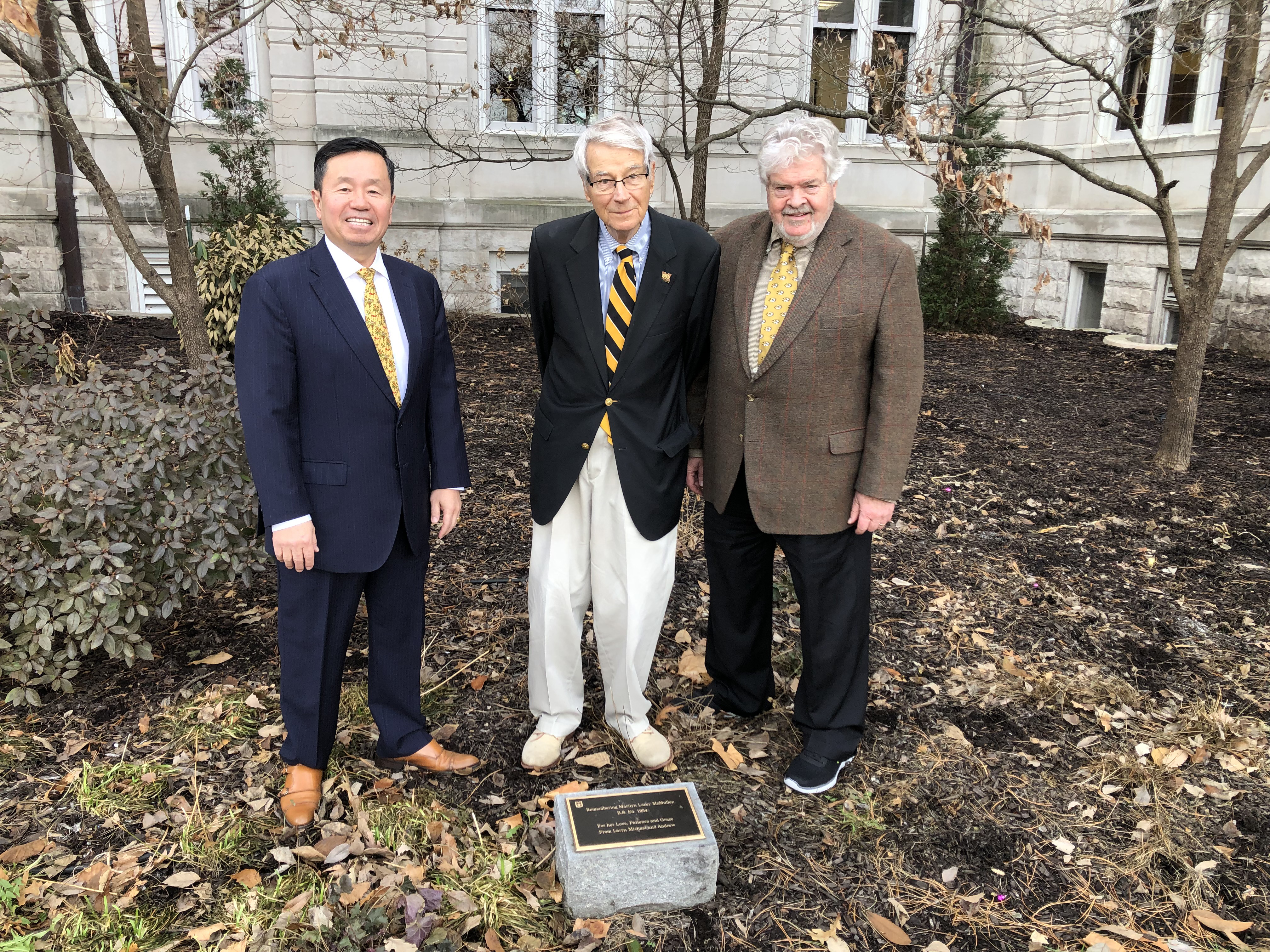 Longtime MUBG board member, Larry McMullen, center, poses in the Marilyn Lacy McMullen Garden — which honors his wife — with UM President Mun Choi and McMullen’s law partner, John Phillips.