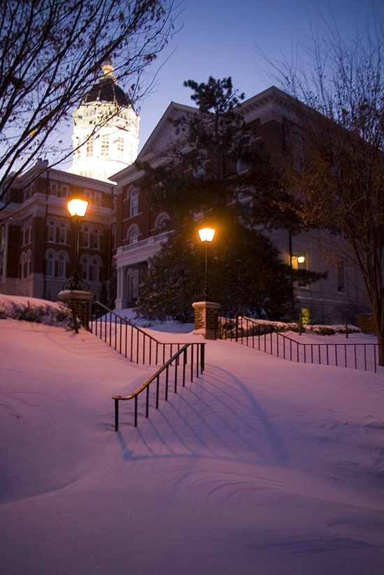   Early morning winter snow covers steps before the snow-removal crews get to this area.